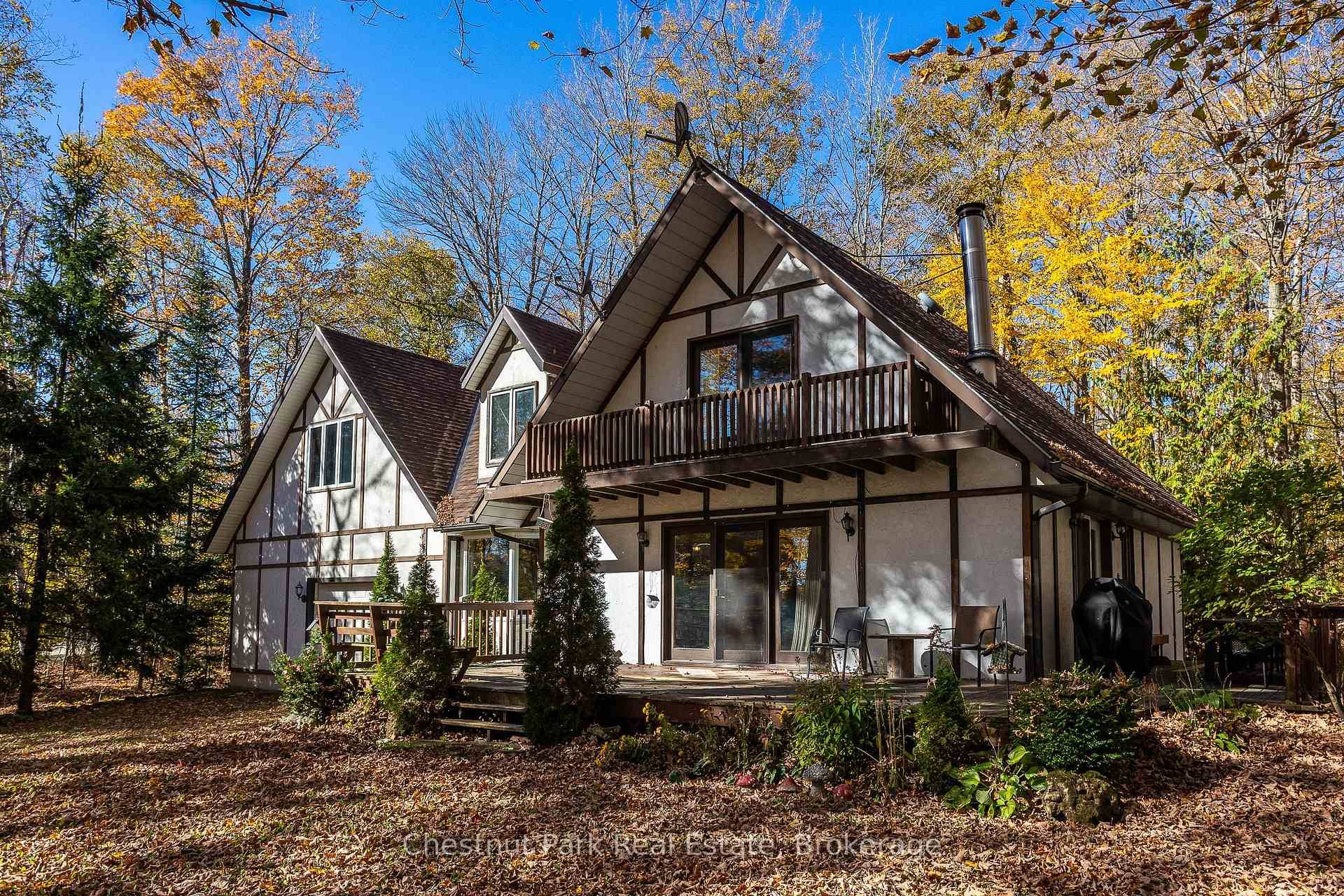 This charming Tudor style, four season home or cottage sits on a serene 2.