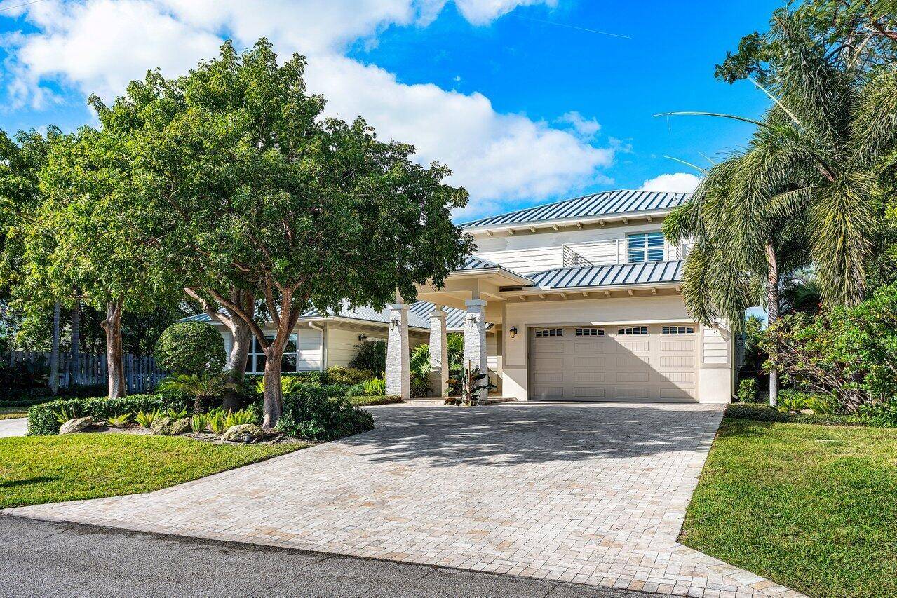 Indulge in the ultimate Delray Beach lifestyle with this 2017 coastal contemporary estate, ideally situated on a quiet street and set on a premier lakeside lot.