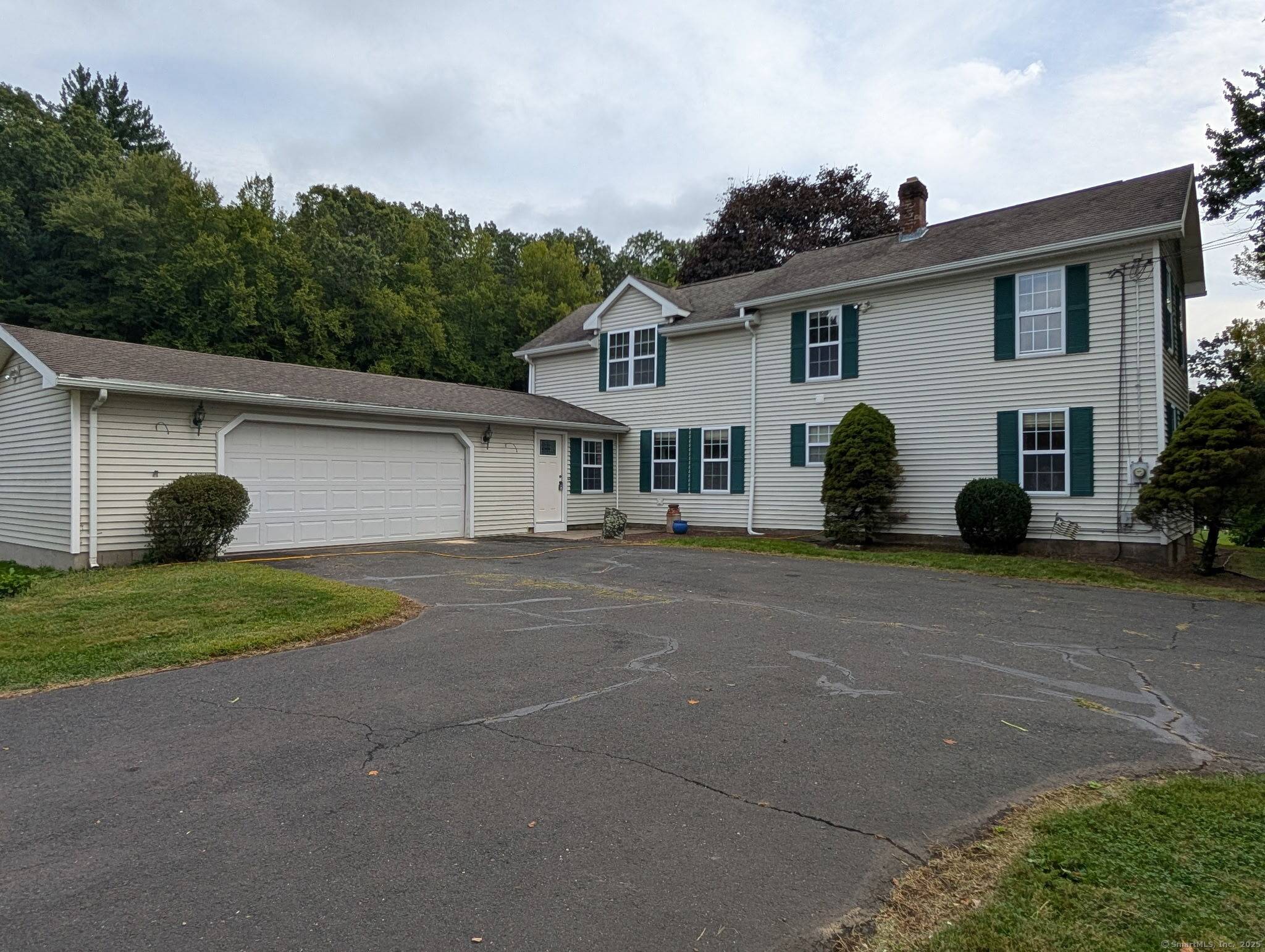 Timeless Retreat Nestled in the serene, rolling hills of Suffield, CT.