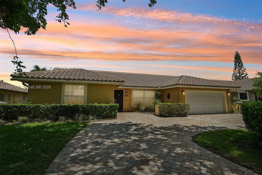 Searching for a 4 bed single family home in Coral Springs with a water view, pool, and updated interior ?