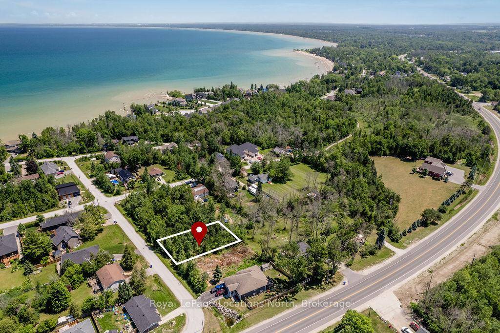 Discover the perfect canvas for your dream home on this great sized lot measuring 65 x 122 ft, nestled steps to the waters of Georgian Bay.