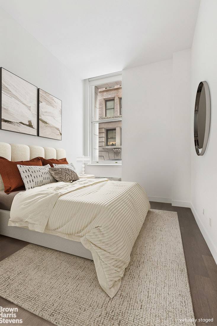 This expansive north facing one bedroom spans 866 square feet and features soaring 10' ceilings, enhancing volume throughout.