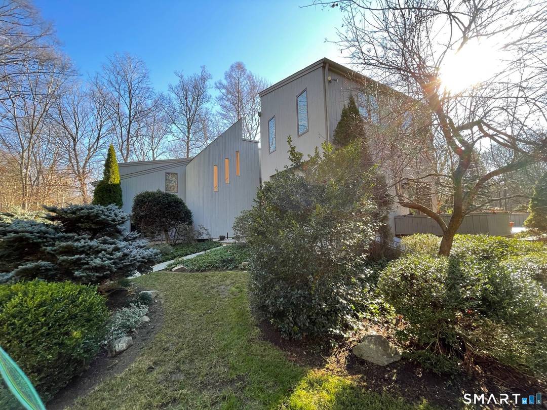 Tucked away on one of Wilton's most picturesque streets, this private retreat feels like a getaway every single day.