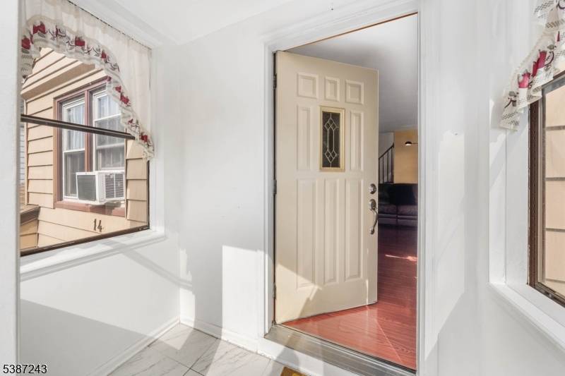 Welcome to 14 Smallwood Avenue, a beautifully maintained Cape Cod that blends classic charm with modern living.