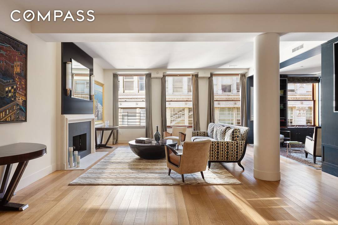 This exquisite triple mint residence enjoys a semi private elevator landing, boasts soaring 11.