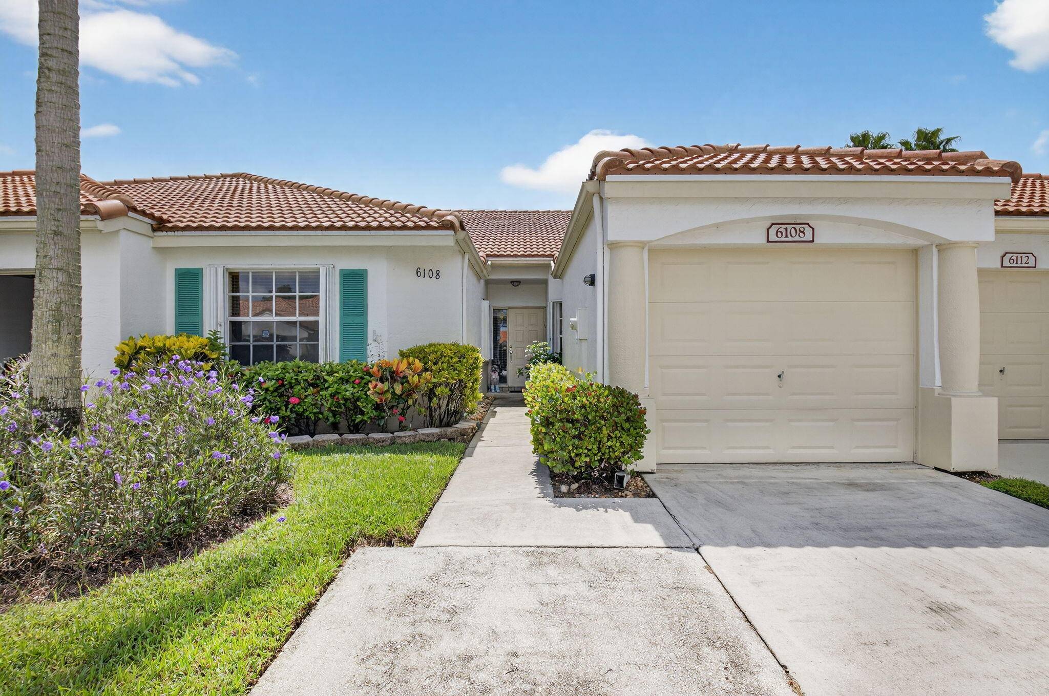 Must see this beautifully upgraded 2 bdr 2 bath villa on a PREMIUM LAKE LOT !