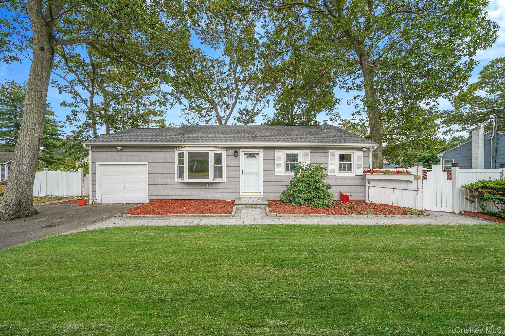 This charming 3 bedroom, 1 bath home is move in ready and perfectly situated in the heart of Lake Grove Village.
