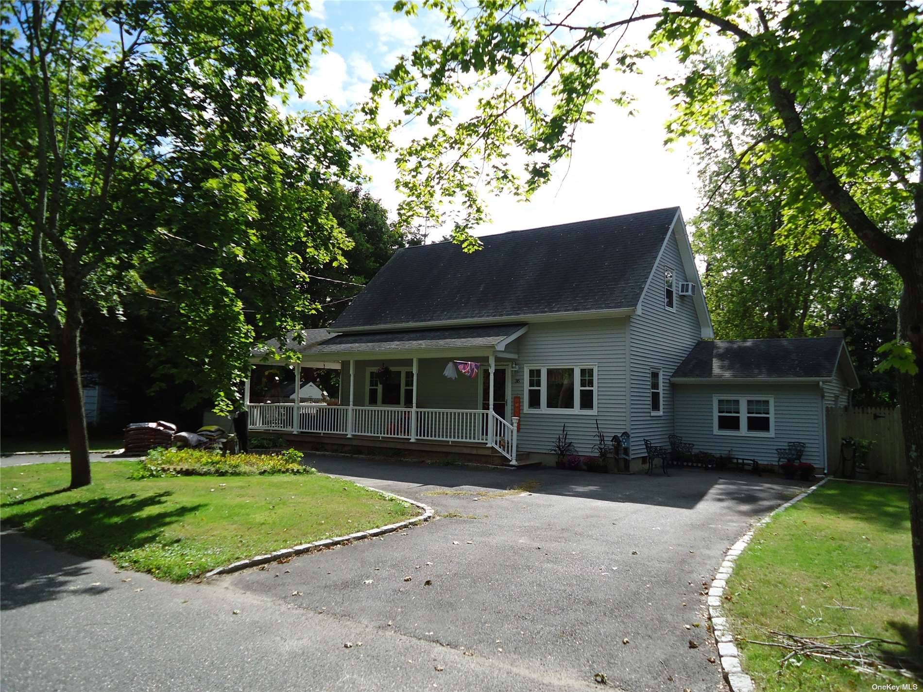 Pretty three bedroom home with two baths and wrap around front porch three season sun room with wood burning stove, large yard for entertaining many new updates to this home ...