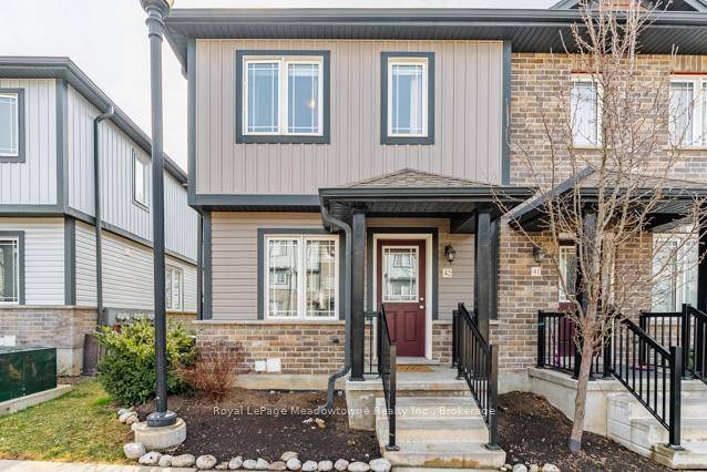 Welcome to this bright and beautifully updated 2 bedroom, 1 bathroom end unit condo townhouse with the cheapest condo fees in Cambridge !