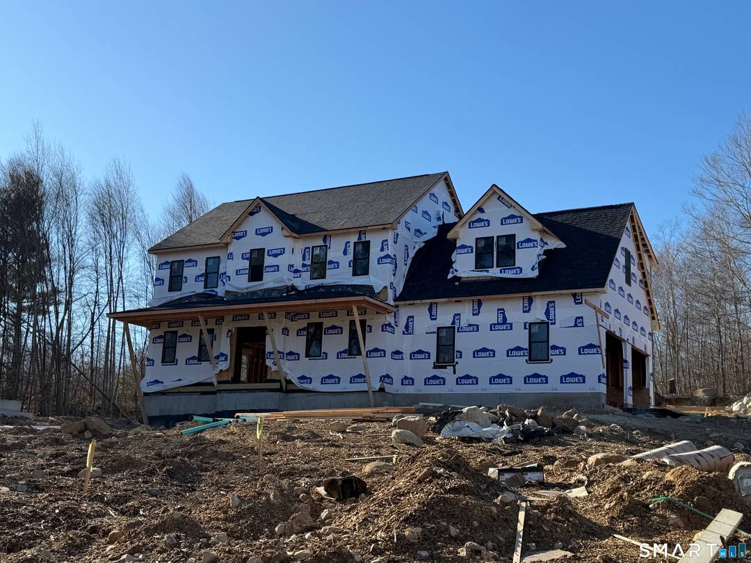 Stunning new construction Colonial set on over 2 private acres in a serene country location.