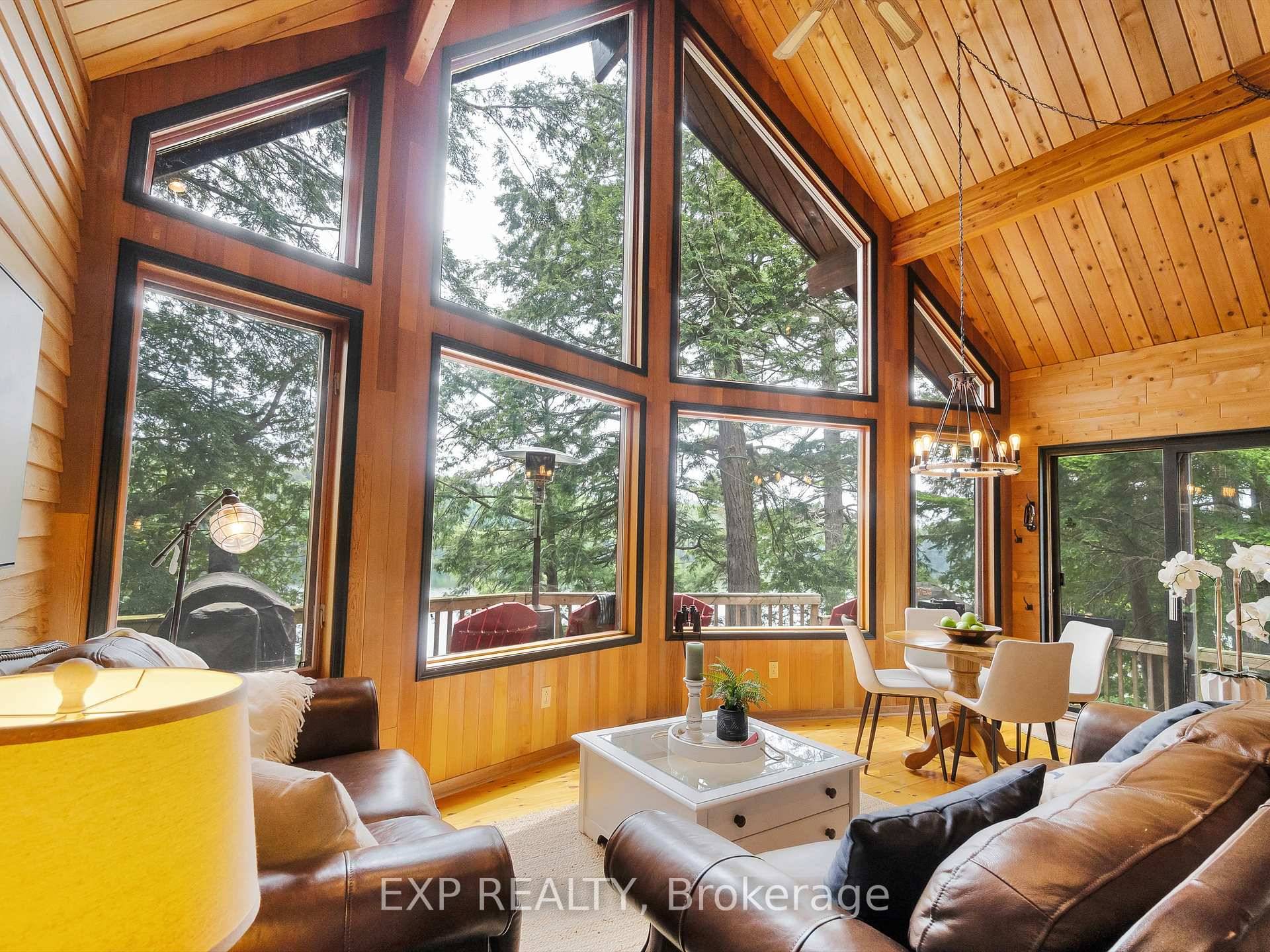 This Spectacular Three Season Water Access Only Property Offers an Exceptional 370 Feet of Private Southwest Facing Shoreline on Sought After Doe Lake.