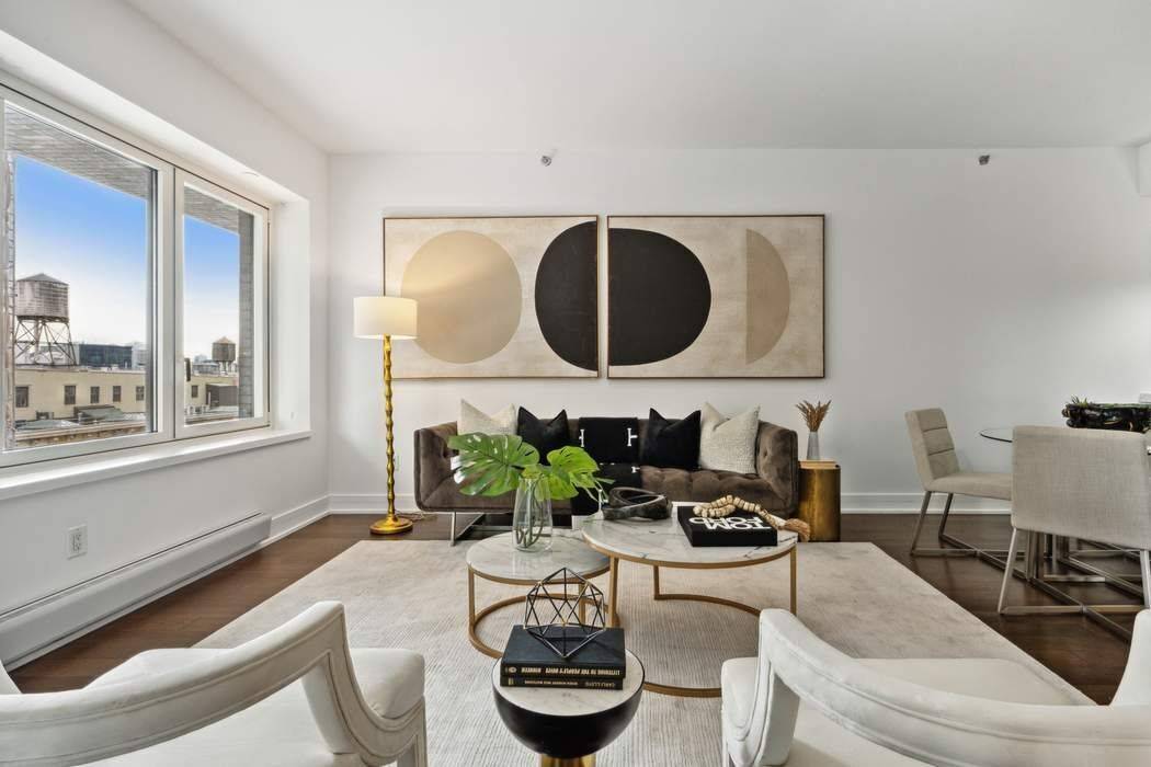 Indulge in luxurious living within this exquisite two bedroom, two and a half bath residence, nestled in one of Tribeca's premier boutique buildings.