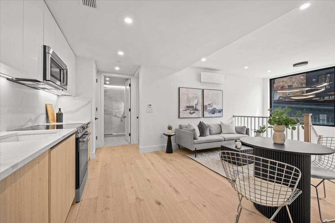 Residence GA at 107 Schaefer Street is a beautifully designed ground level duplex offering a unique blend of luxury, flexibility, and modern comfort amp ; parking in the heart of ...