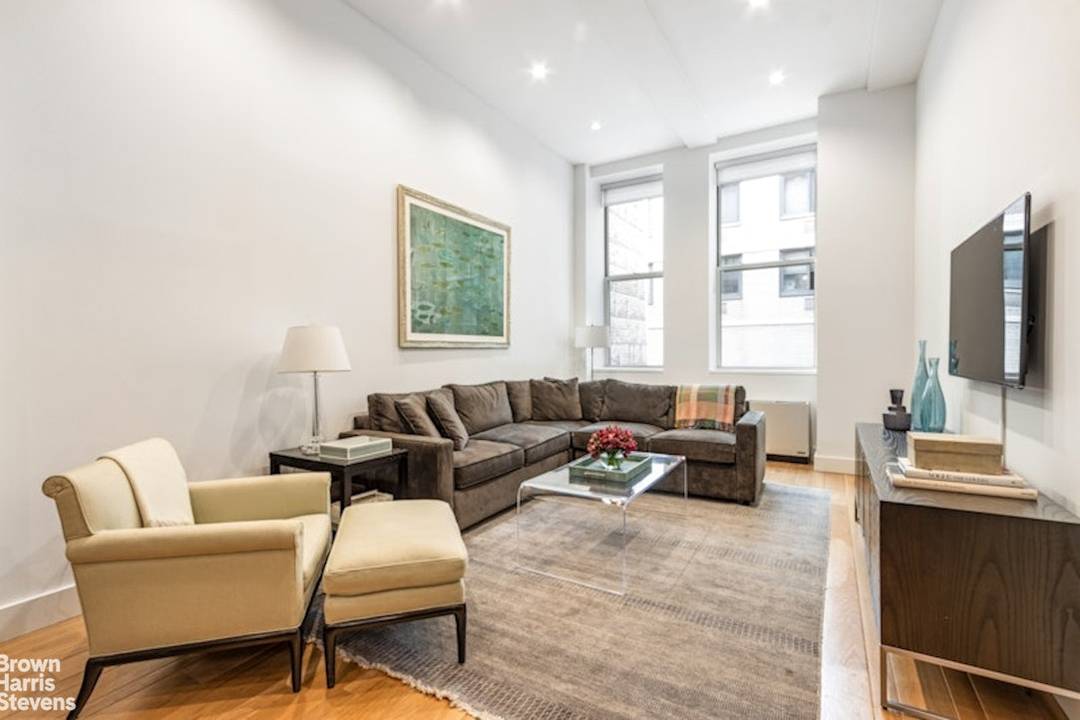 Pre War Full Service Flatiron Loft Condominium with Two Bedrooms and Two Baths.