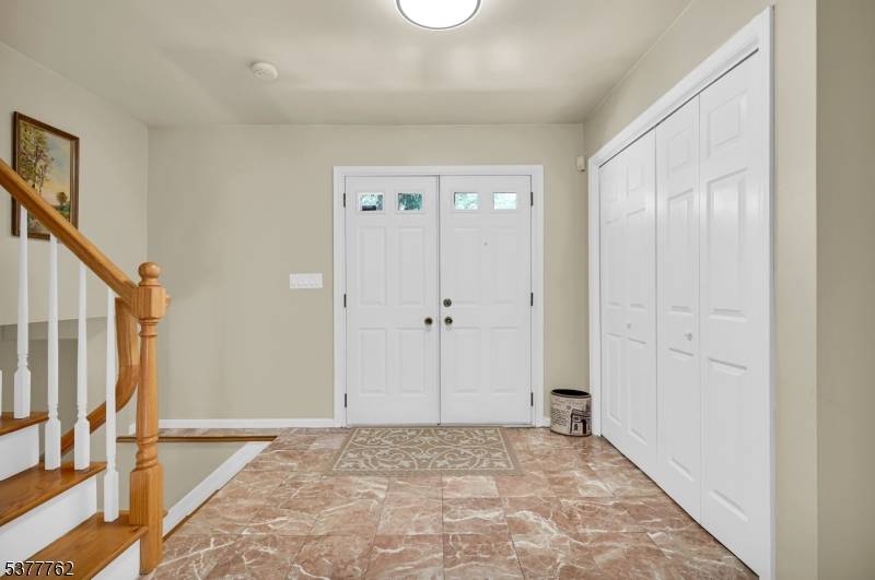 Discover this stunning 4 bedroom, 3 bath split level home perfectly nestled in a peaceful, sought after neighborhood, complete with a circular driveway for added convenience and curb appeal.