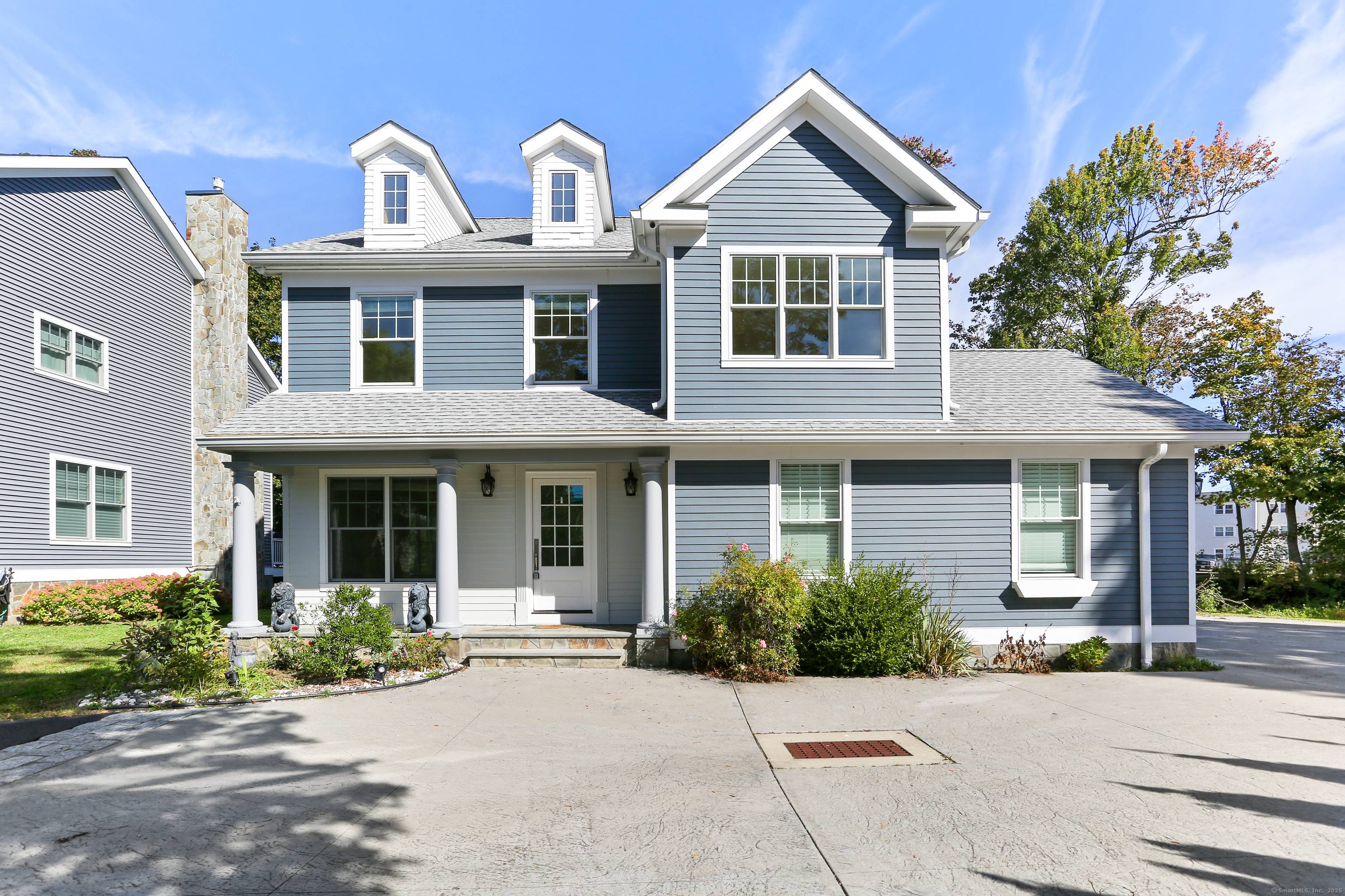 Experience refined living in this exceptional four bedroom Colonial, privately set in the desirable Black Rock neighborhood.