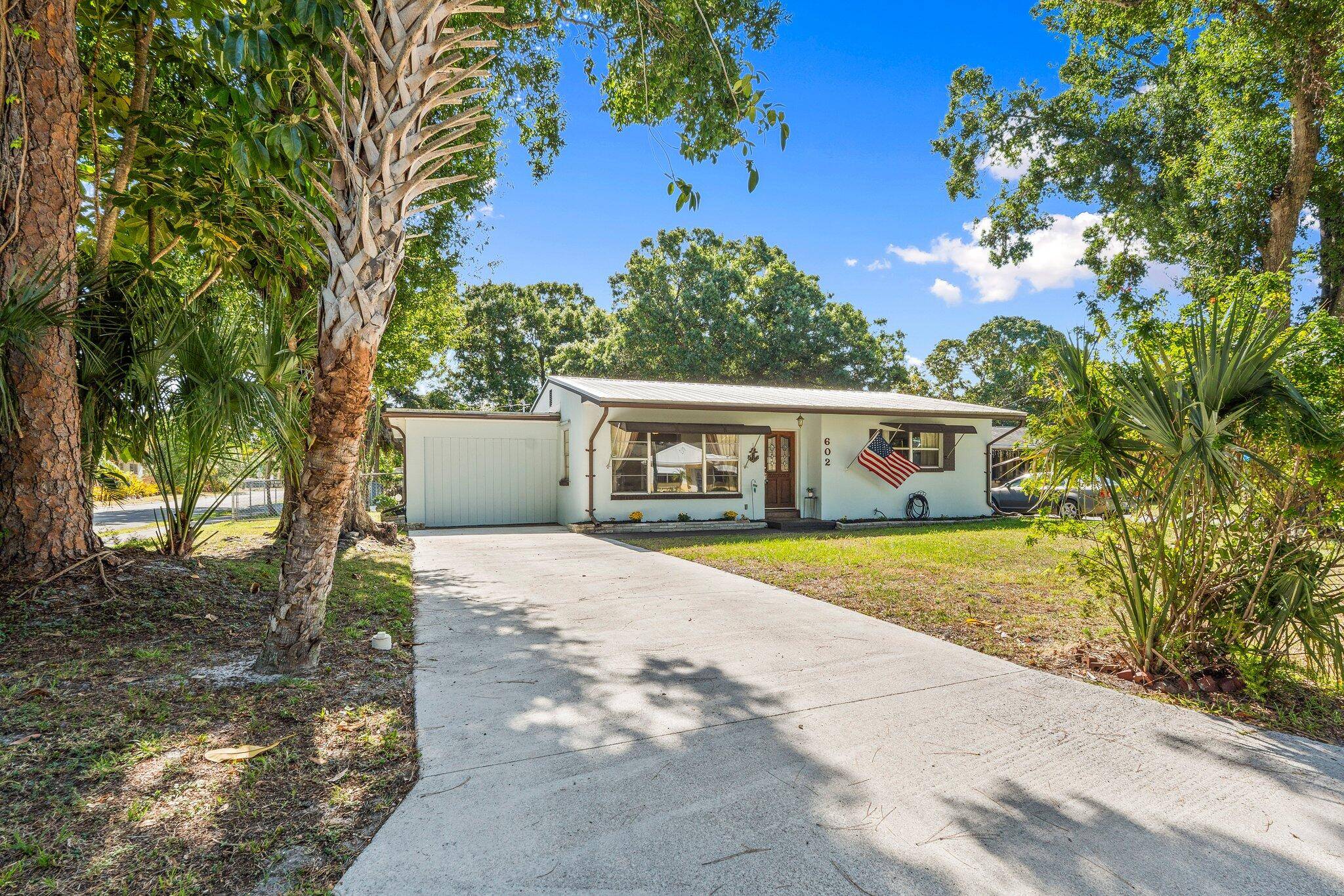 Charming 2 bedroom, 1 bath home on a spacious, tree lined corner lot.