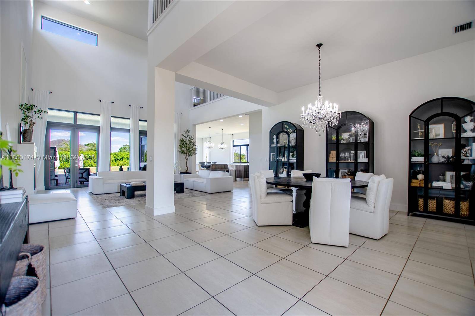 Stunning 2023 estate in Southwest Ranches, set on a fully fenced 1 acre lot offering the perfect blend of luxury and functionality.