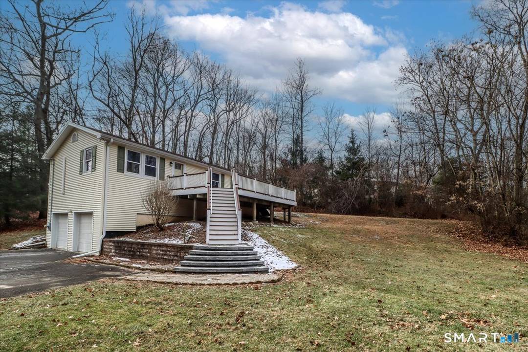 27 Long Meadow Lane offers 3 bedrooms and 2 full and 1 half baths.