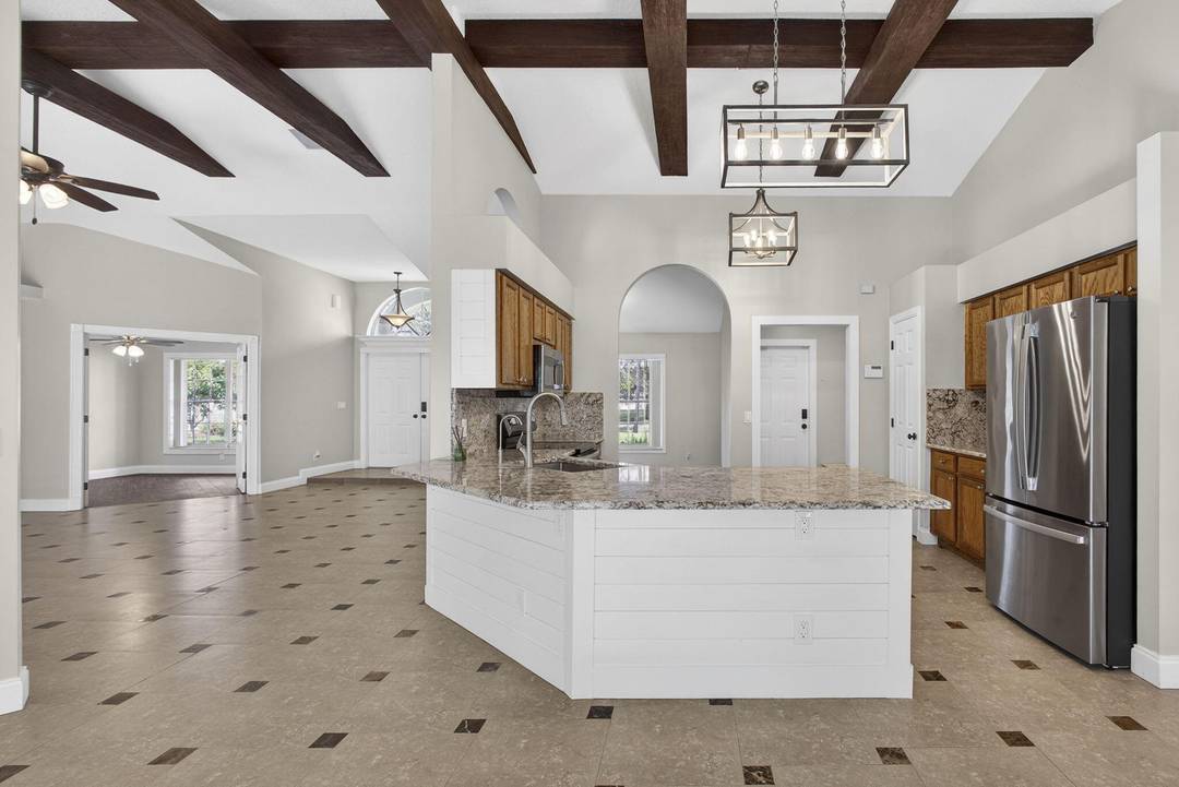 Welcome to 11646 63rd Lane, a rare opportunity to enjoy space, privacy, and luxury in the heart of Loxahatchee.