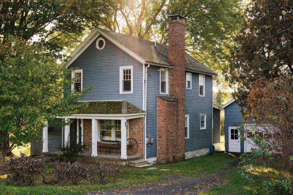 Experience the serene beauty of Southern Columbia County with this enchanting 1920s farmhouse, nestled perfectly between Germantown and Tivoli Bard College.