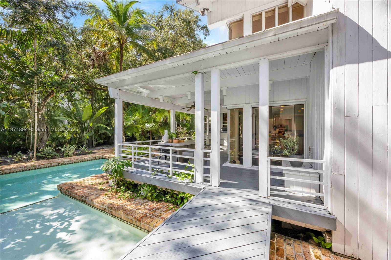 Commanding a privileged location within the prestigious gated community of Snapper Creek Oaks this unique home designed by John Weller encompasses approximately 5, 600 sf of generously scaled interiors.