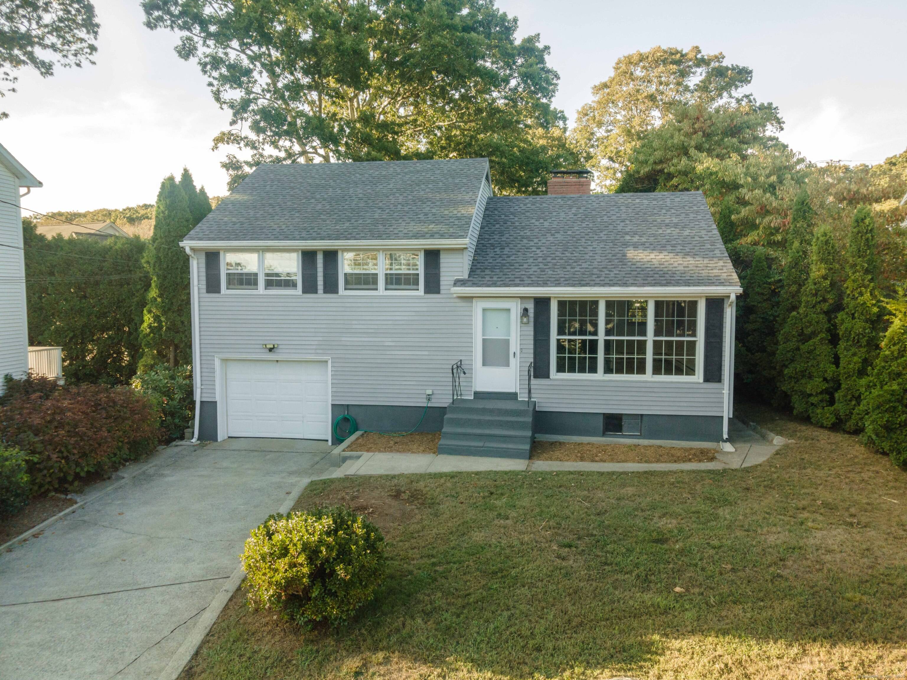 Welcome to 859 Shennecossett Road in Groton City a quality built split level home combining comfort, character, and convenience in one of Groton's most desirable coastal neighborhoods.