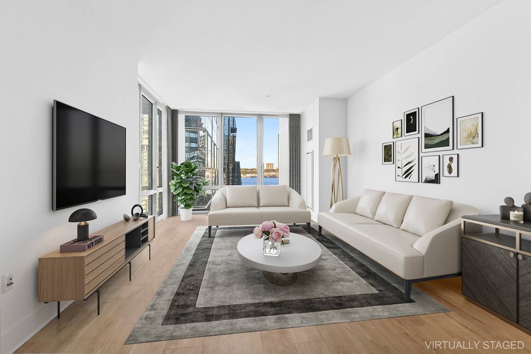 Enjoy unobstructed views of the Hudson River all day long from this spacious 824 square foot one bedroom condominium at 10 West End Avenue in the West 60's, an amenity ...
