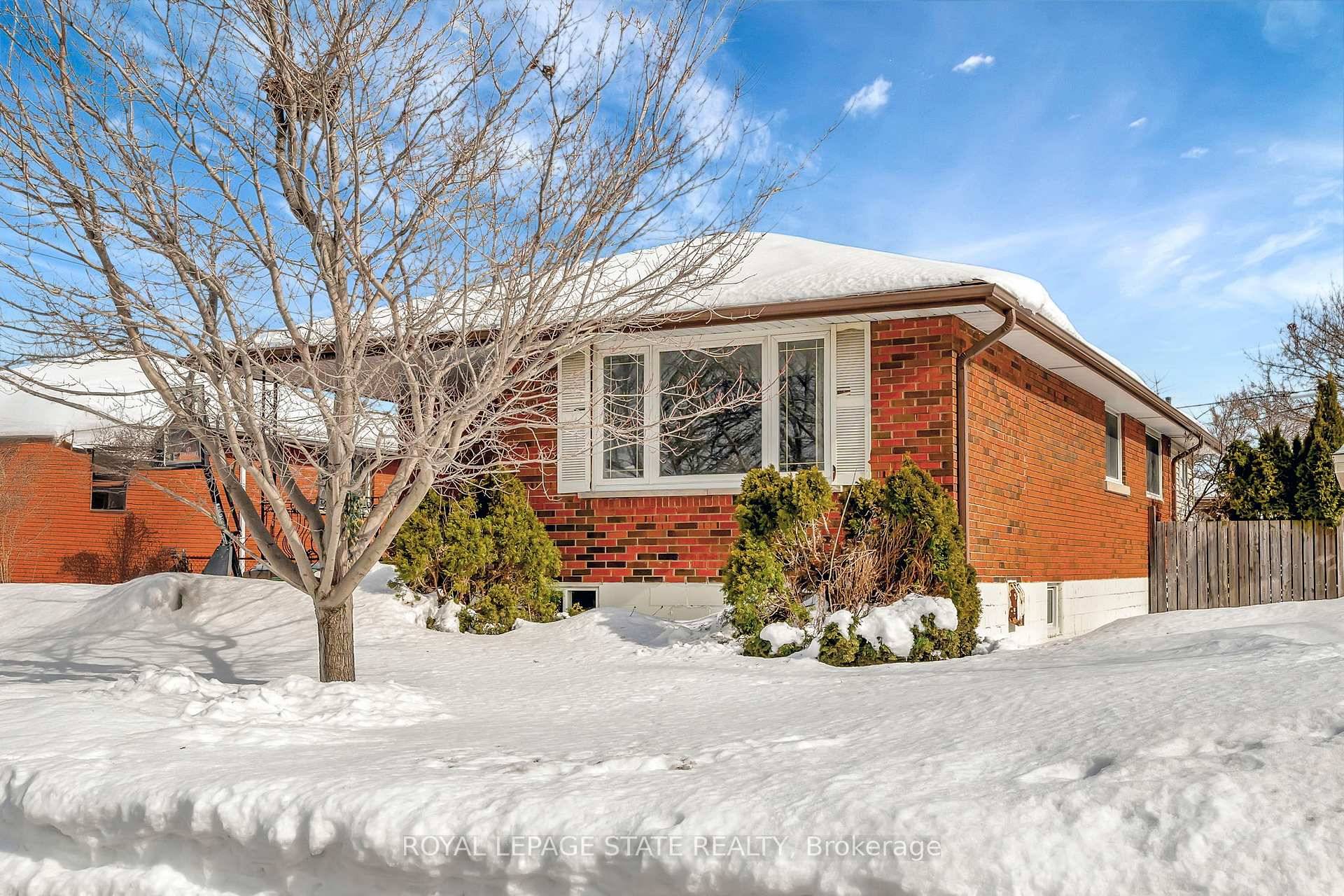 This solid brick bungalow on Central Hamilton Mountain is larger than it looks !