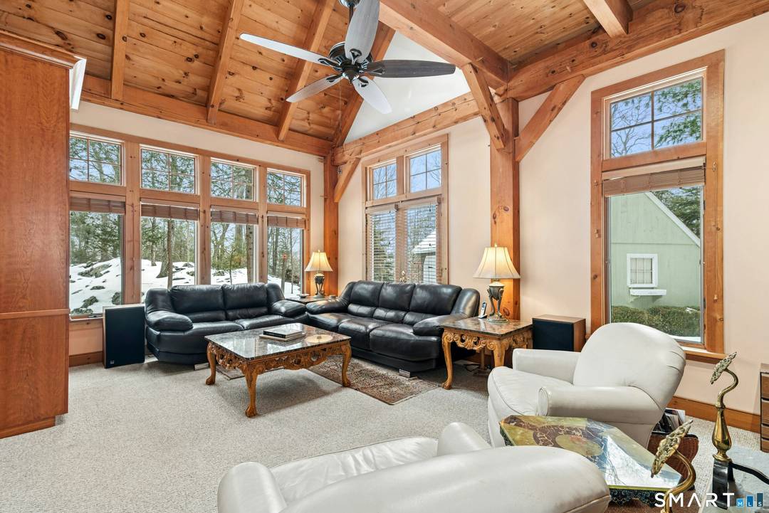 Perched high on 2 private acres, this home is an ideal full time primary residence or a peaceful weekend retreat.