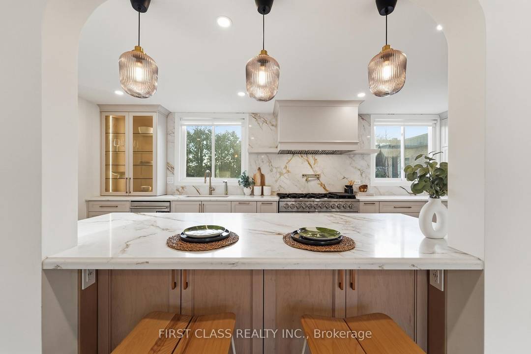 Backing Directly Onto Parkland Rarely Offered In Prestigious Bayview Fairways.