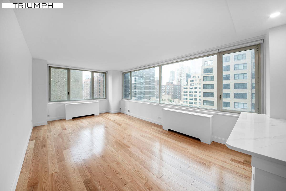 This newly renovated unit is a corner apartment with Wall of Windows and city views.