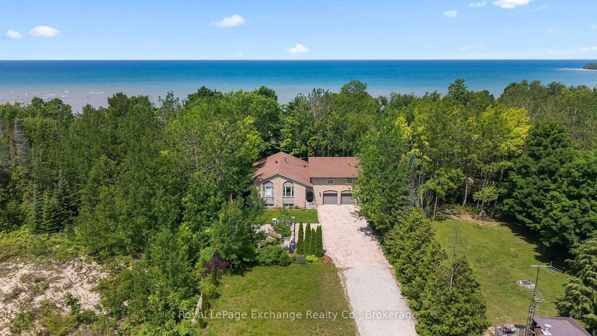 Welcome to this stunning 1 acre lakefront property offering 69 feet of pristine shoreline and breathtaking Lake Huron sunsets.
