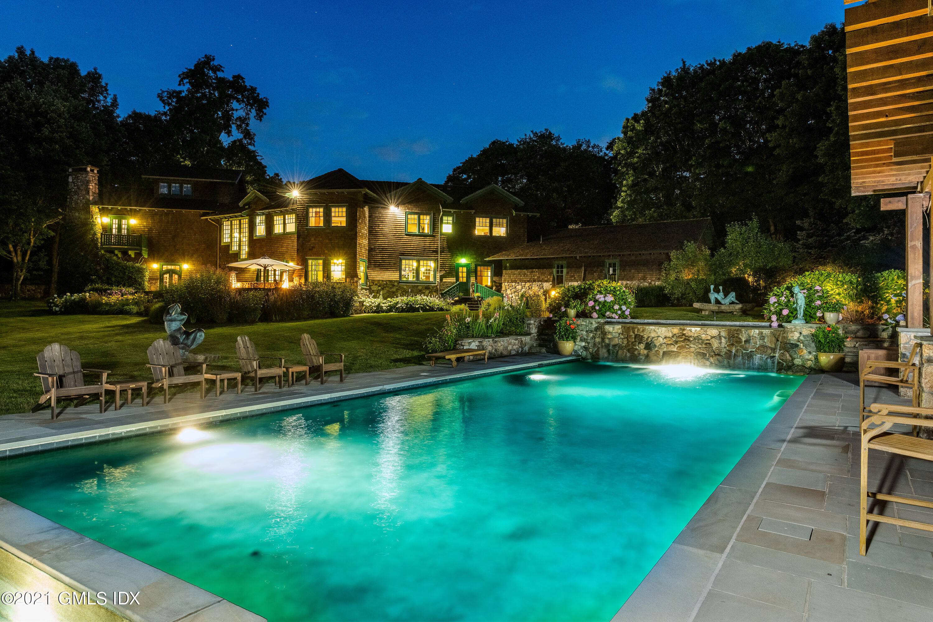 Resort style living in the privacy of backcountry Greenwich on the lake.