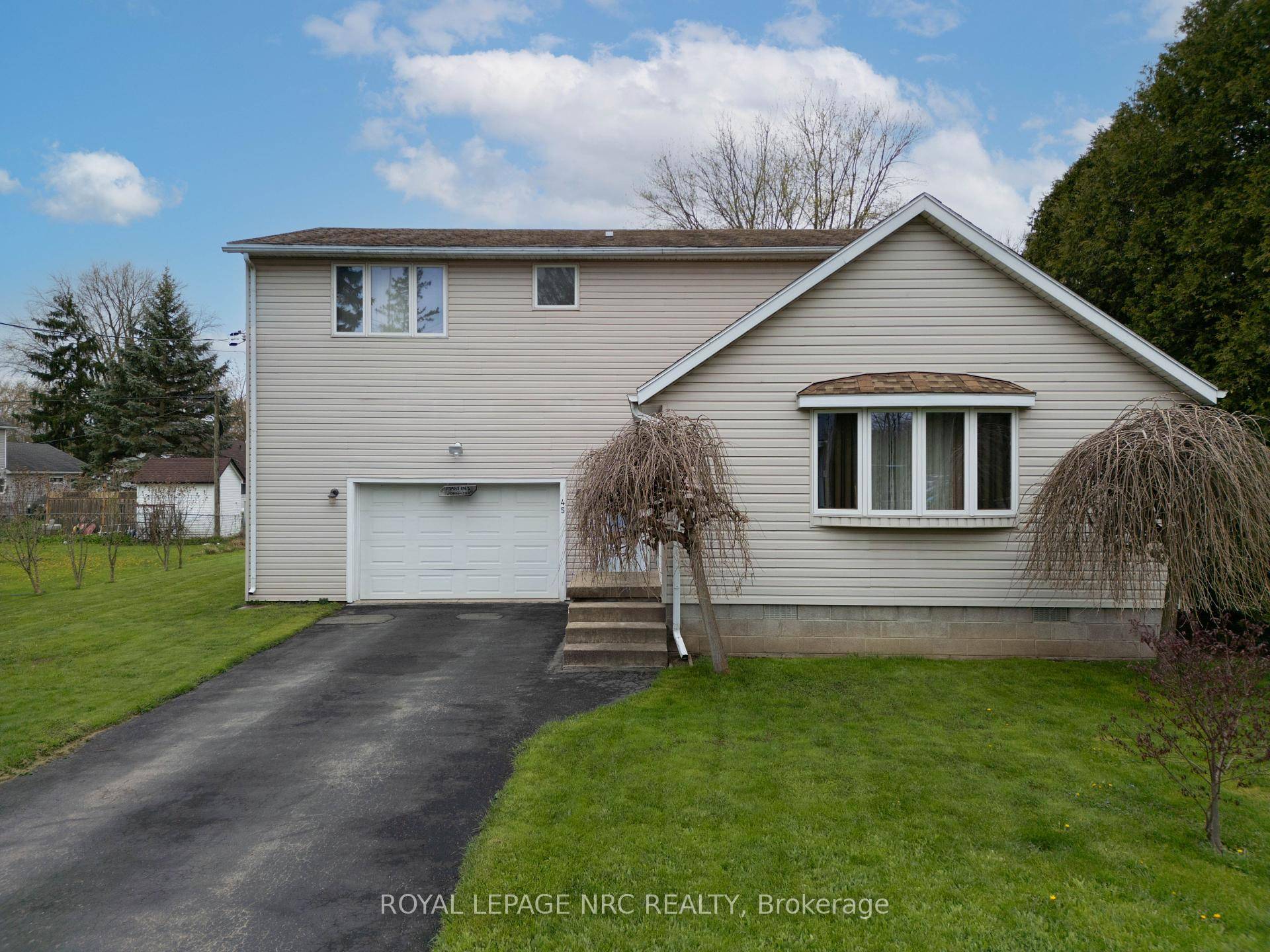 Nestled in the charming community of Crystal Beach, this remarkable two story residence at 45 Ridgeway Rd offers a unique glimpse into the past while providing comfortable modern living.