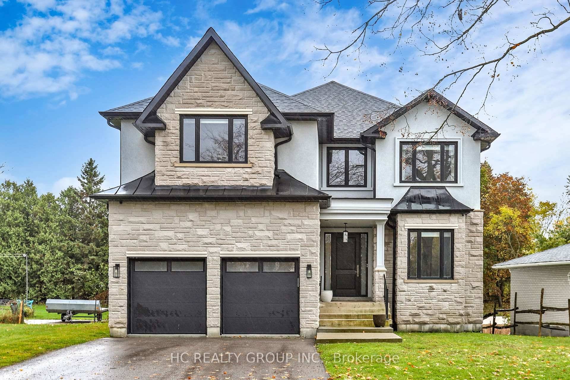 Stunning, custom built 4 bedroom residence sitting on a 50 x 190 ft.