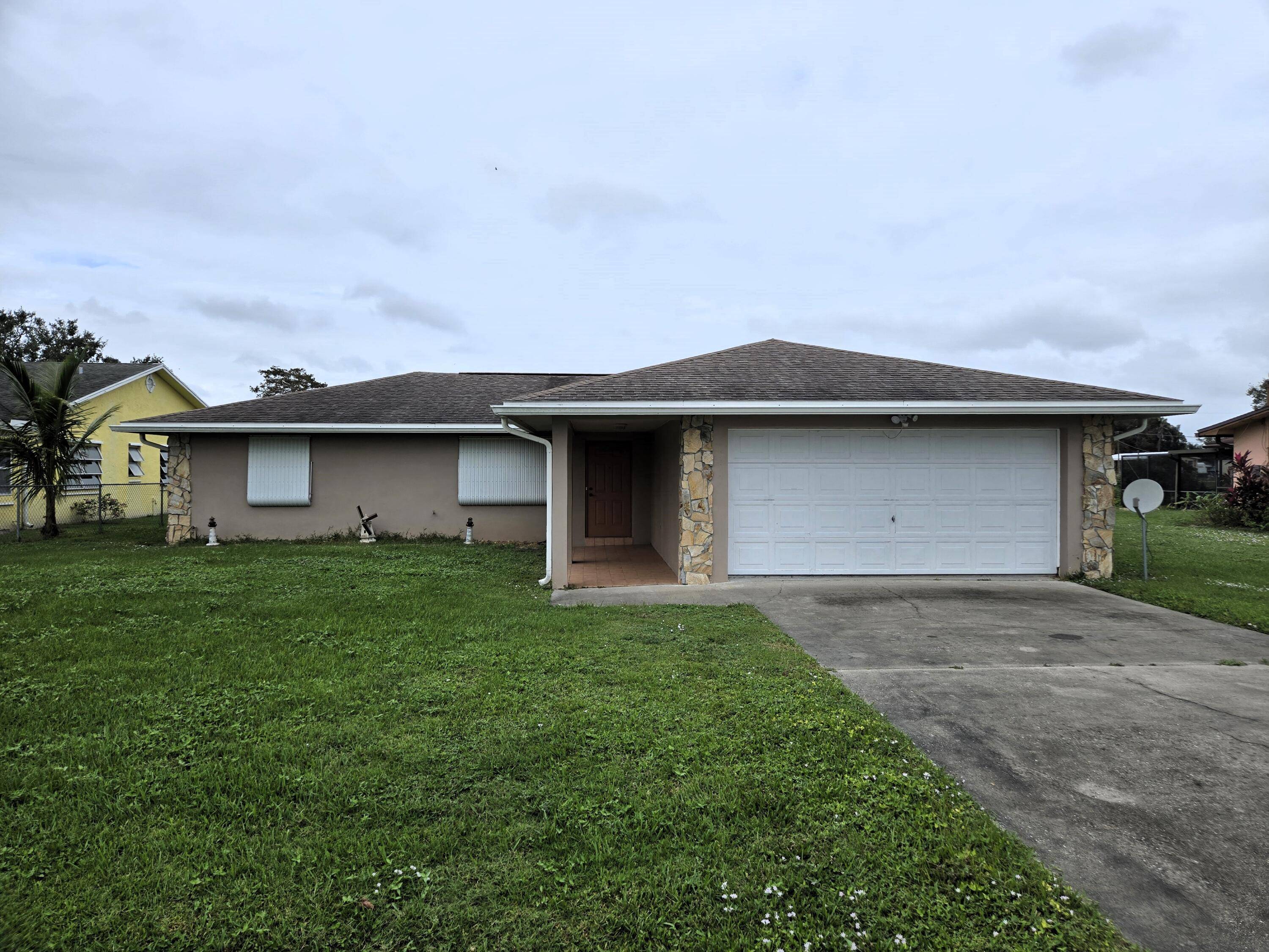 LAKE OKEECHOBEE ACCESS TREASURE ISLAND Well Maintained 3 bdrm 2 ba 2 car garage home with 1, 532 lvg sq ft and 2, 113 overall sq ft.