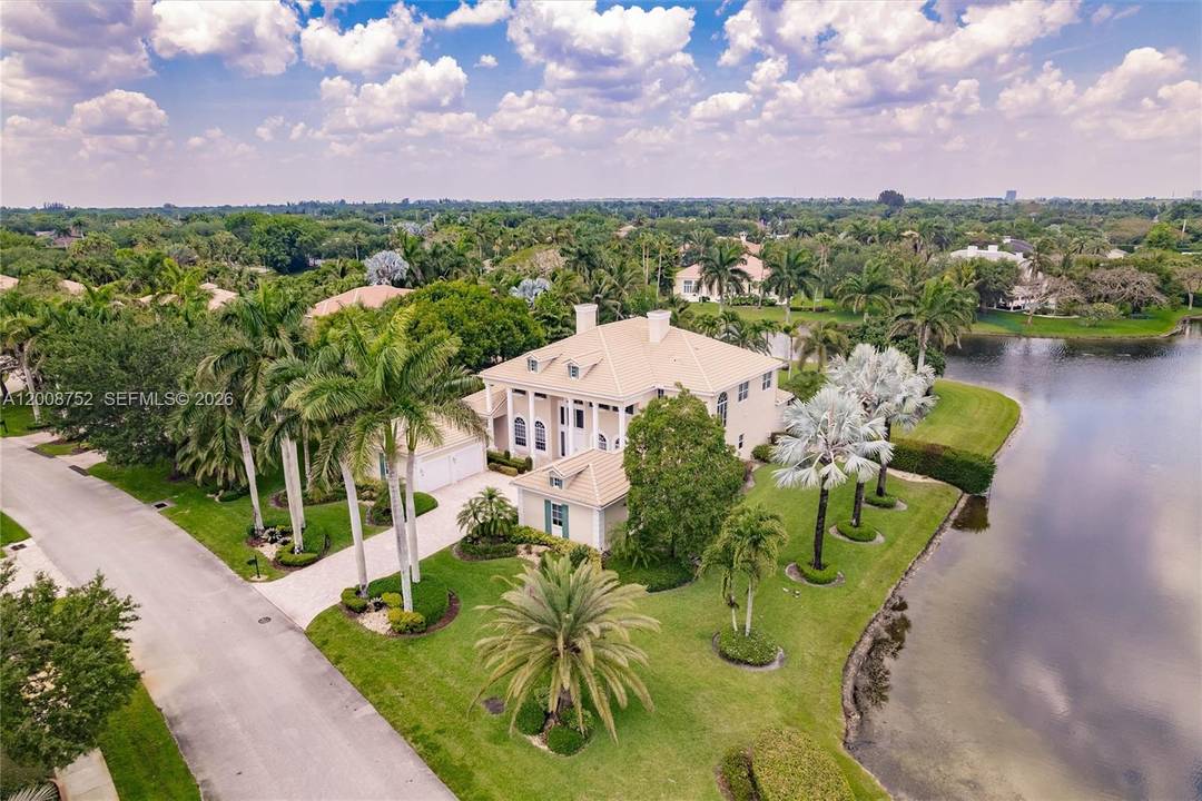 Enjoy wide water views spanning over 180 feet from this premium corner lot on a builder s acre.