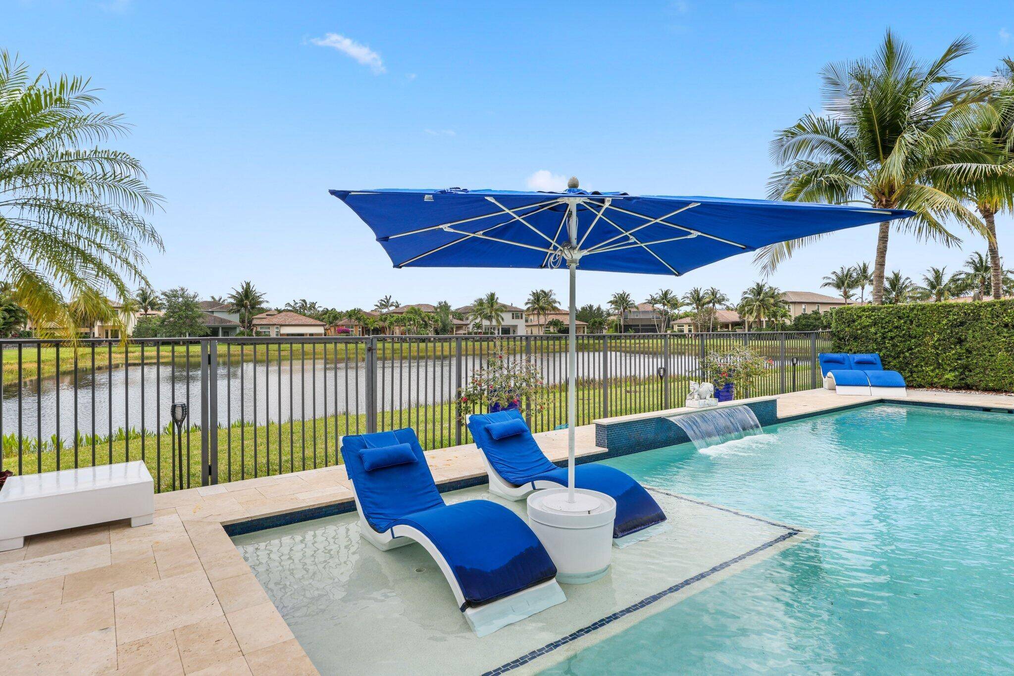 Magnificent ranch style home situated on a picturesque lake lot in The Bridges.