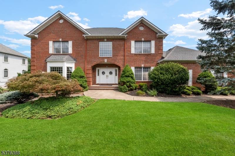 Located in one of Pine Brook's most desirable neighborhoods, this 5 bedroom, 3.