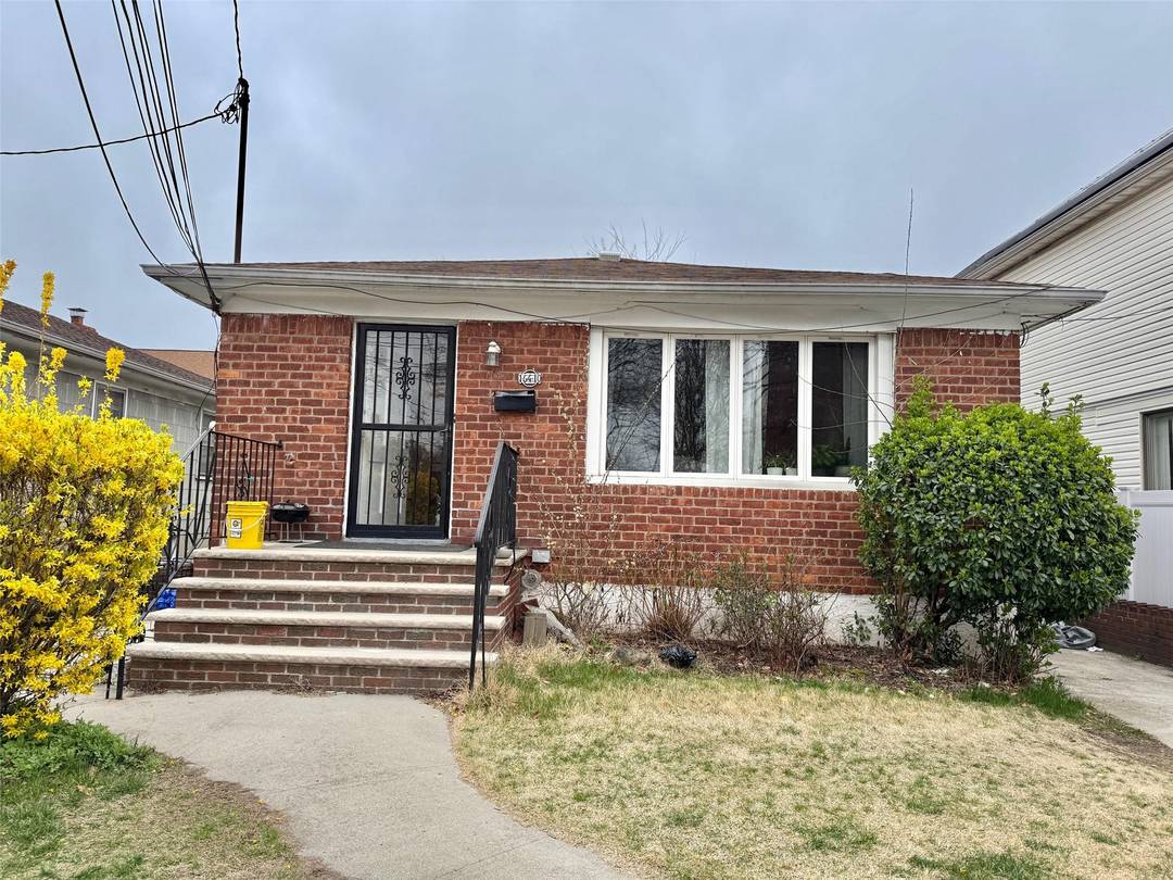 motivated seller. Mint condition one family ranch house in the heart of Jamaica Queens with driveway, full basement with separate entrance.
