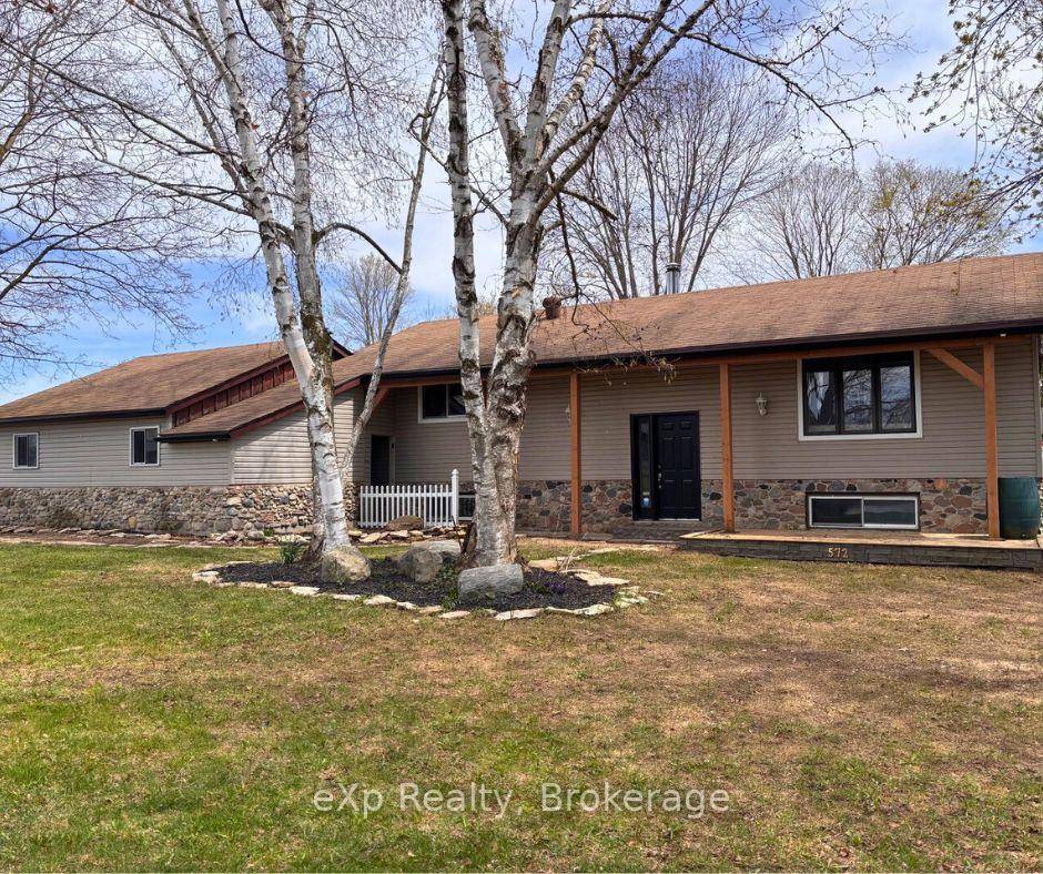 Situated in a small community just a short drive from larger towns, this raised bungalow offers both comfort and convenience.
