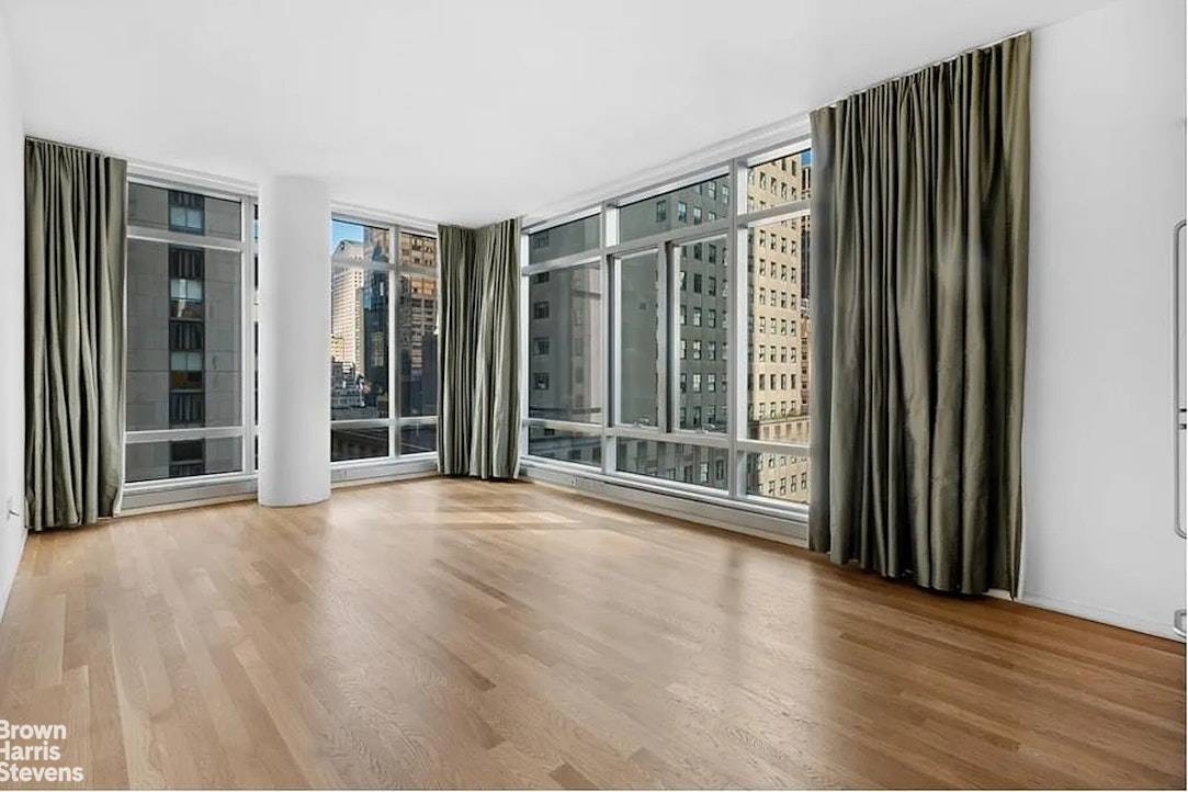 Experience luxurious living in this bright corner one bedroom residence at The Centria, a full service condominium located at 18 West 48th Street.