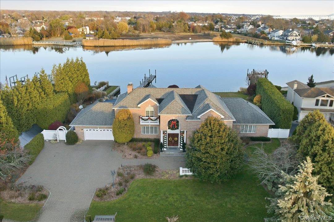 Welcome to an exceptional waterfront retreat, ideally situated along Babylon s largest natural waterway, Carll s River.