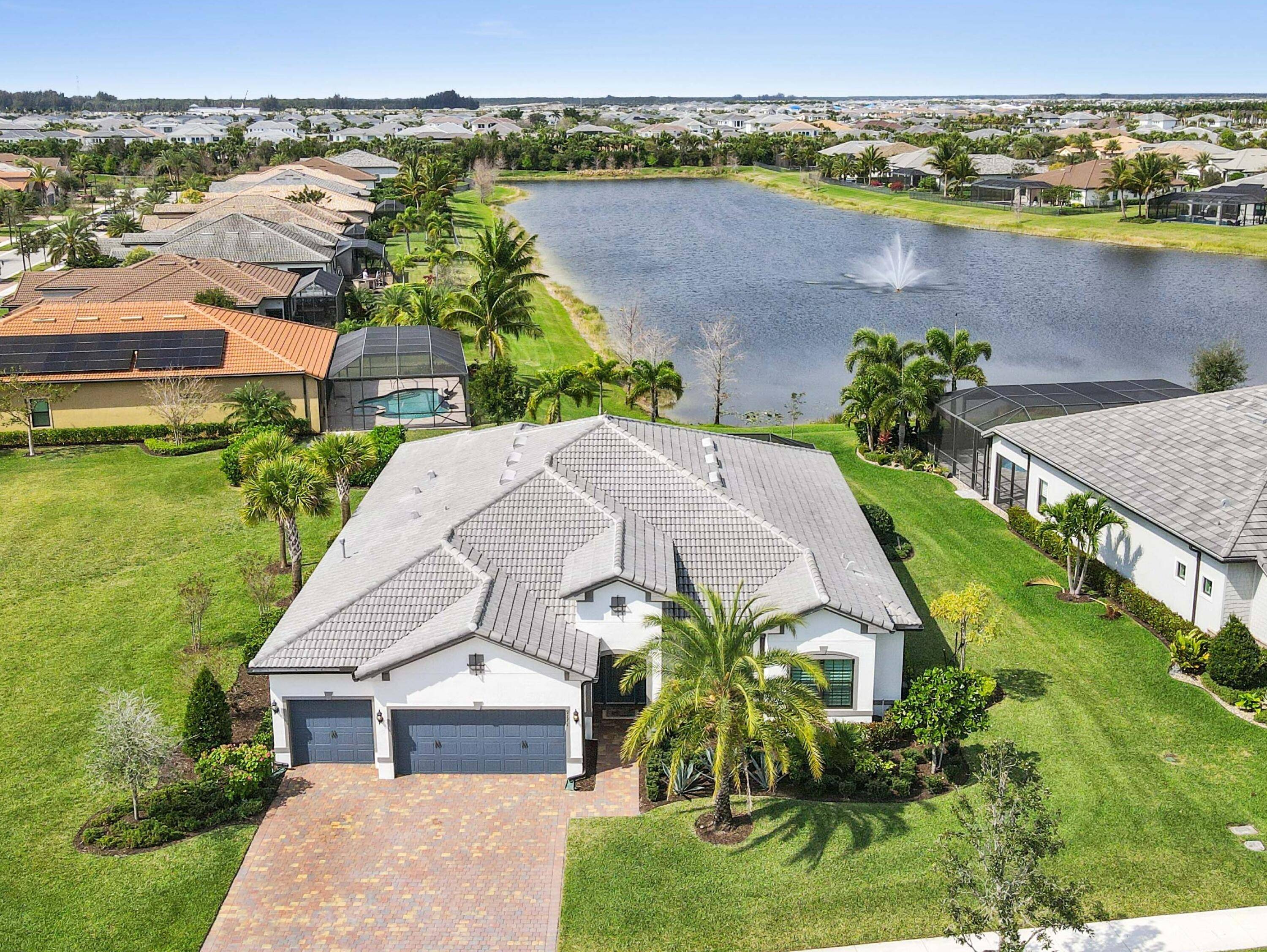 Experience unparalleled elegance in this stunning 2021 built waterfront home, perfectly situated on an oversized lot in the prestigious Ancient Tree community.