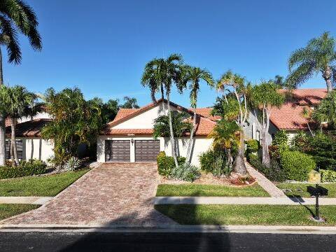Discover effortless elegance in this beautifully maintained ranch style, single level home located in the prestigious, gated Boca Pointe community with 24 7 security.