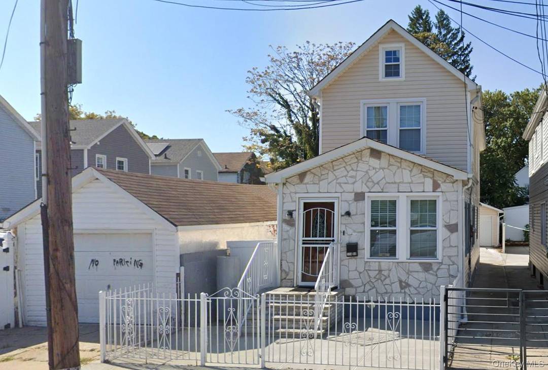 This fully renovated Colonial house with new plumbing, electrical, kitchen and bathroom fixtures also has new flooring and a finished basement with separate entrance.