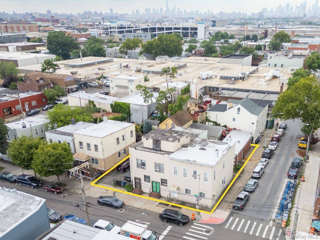 Rare Queens corner lot with significant air rights potential, existing mixed use buildings, and value add or ground up development options.