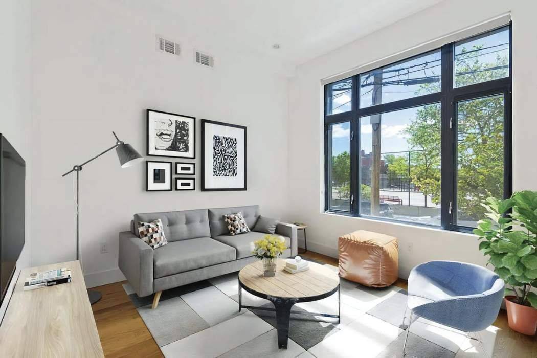 Experience the epitome of urban living in this recently renovated three bed, two bath apartment, boasting a massive 500 square foot private backyard.