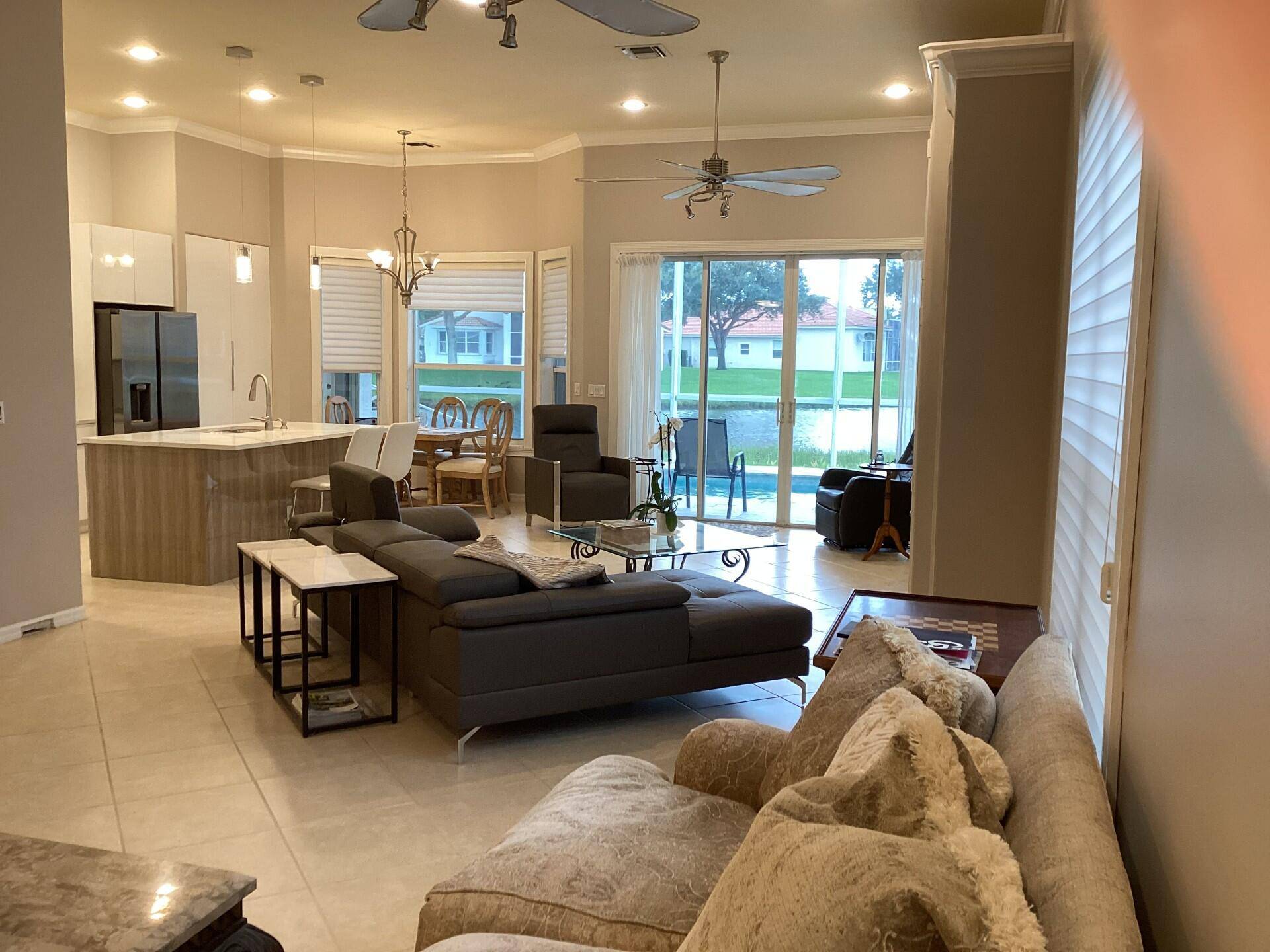 This welcoming retreat features an open concept layout highlighted by magnificent water views from the Kitchen, Family Room, Living Room and Master Bedroom.